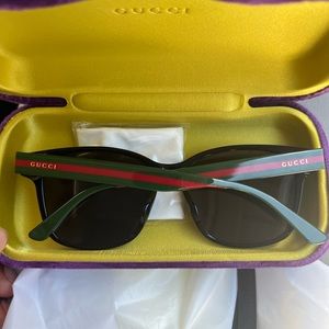 Black Gucci Unisex stylish sunglasses at a half off price.